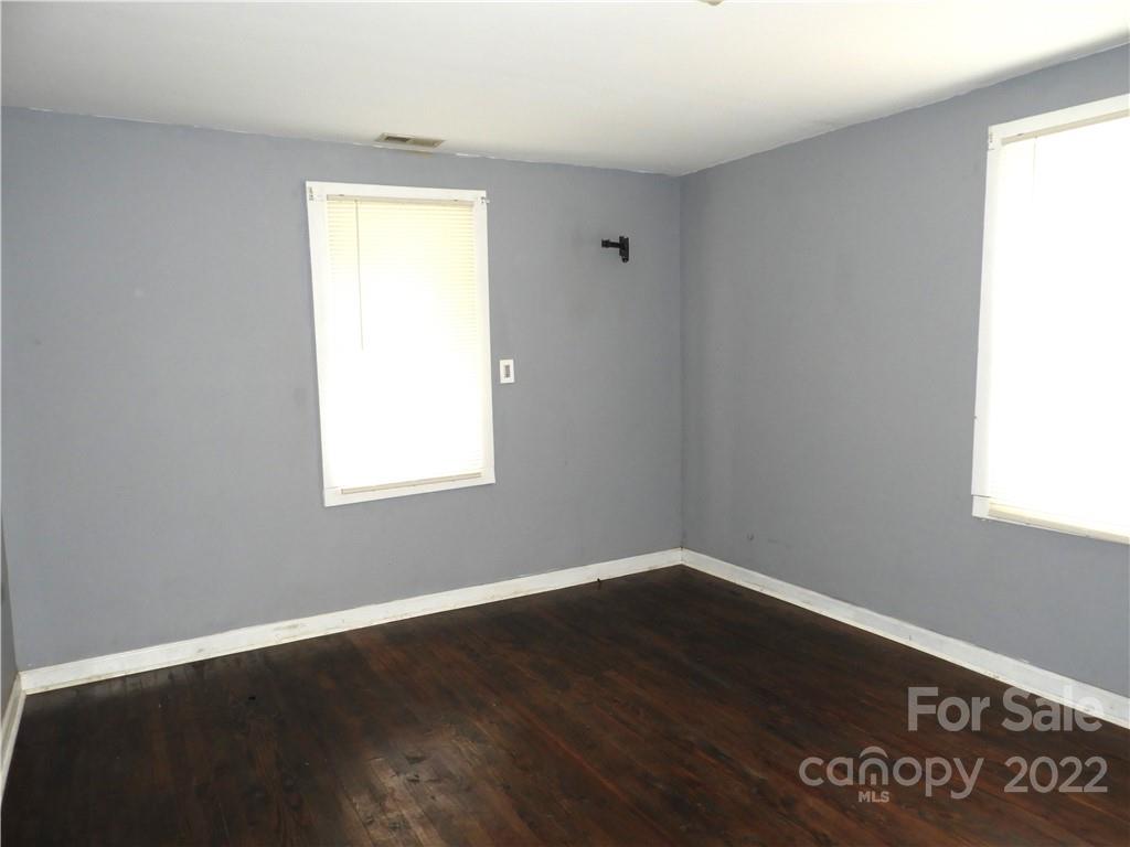 529 Jacktown Road Marion, NC 28752 - Photo 8 of 14 a view of a room that has wooden floor and a window