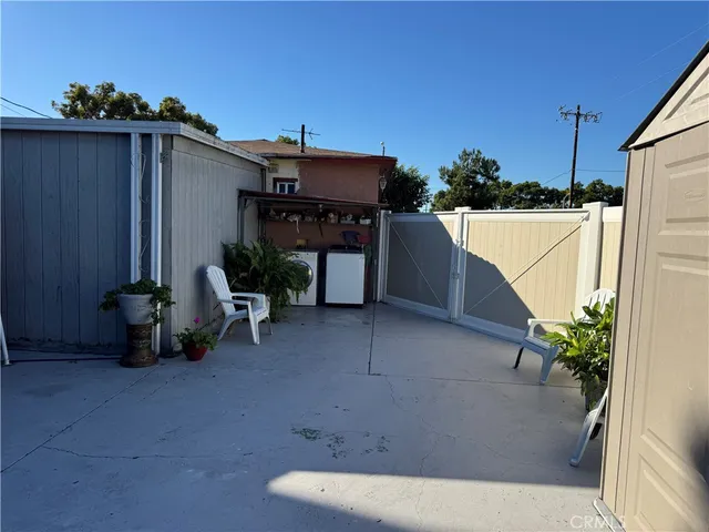 a view of a terrace with chairs and a potted plant