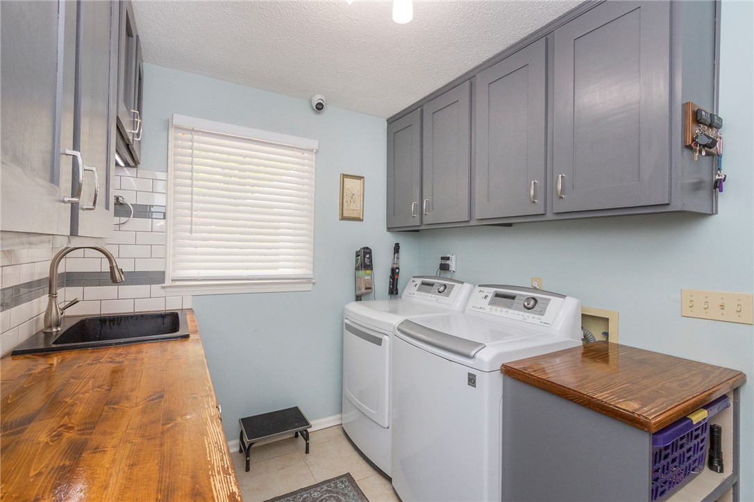 203 Oak Hollow Pendleton, SC 29670 - Photo 16 of 50 Functional utility room with ample storage and a convenient sink.