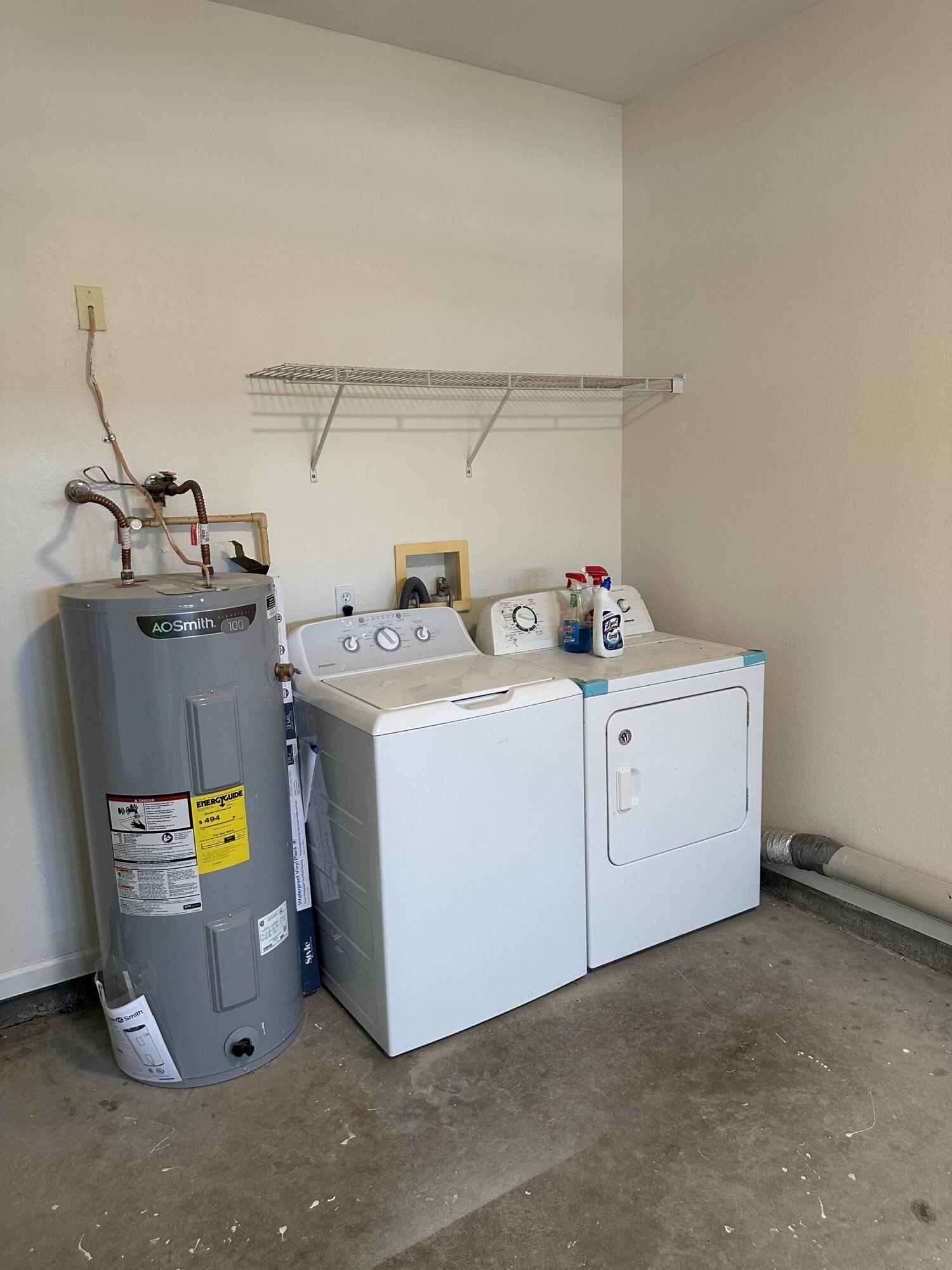 1150 Airport Road, Unit 138 Destin, FL 32541 - Photo 16 of 16 a utility room with dryer and washer