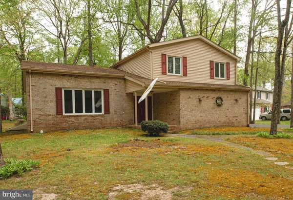 a front view of a house with yard