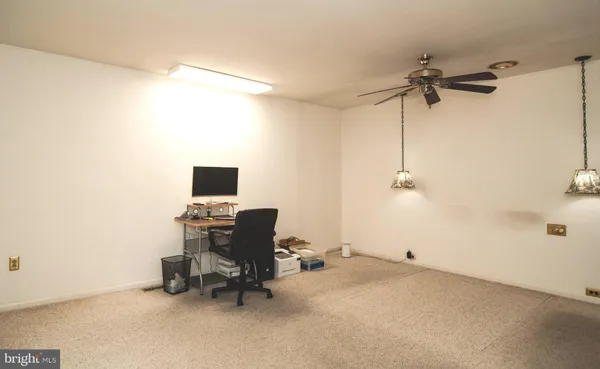 a view of a workspace with a couch