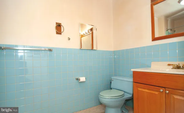 a bathroom with a toilet and a sink