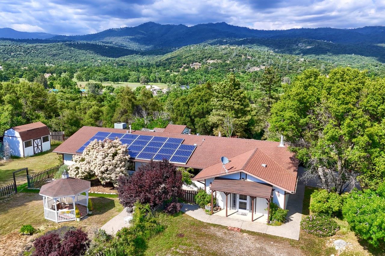 an aerial view of a house with a garden