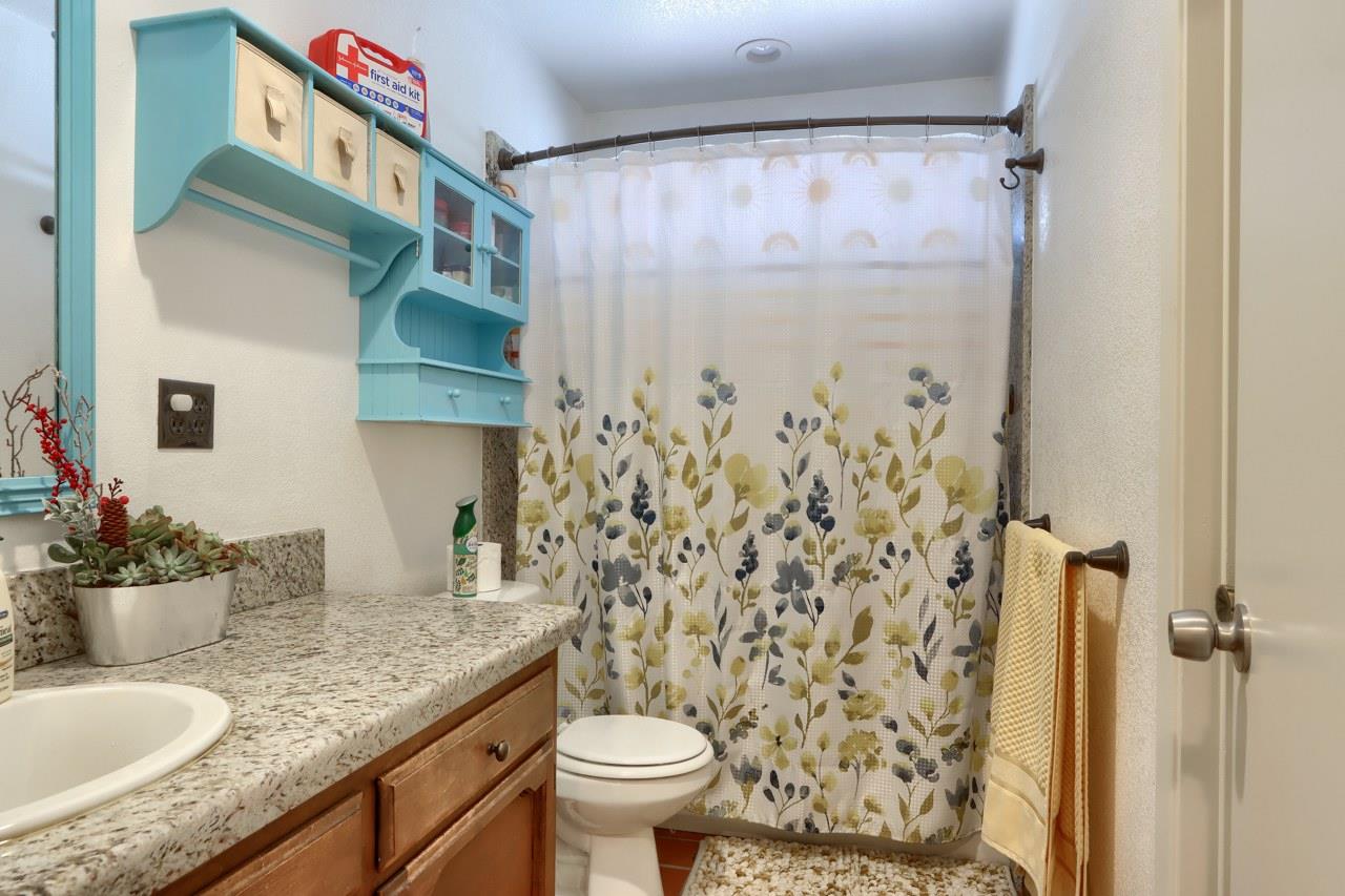44800 Ahwahnee Acres Road Ahwahnee, CA 93601 - Photo 23 of 77 a bathroom with a granite countertop sink toilet and shower