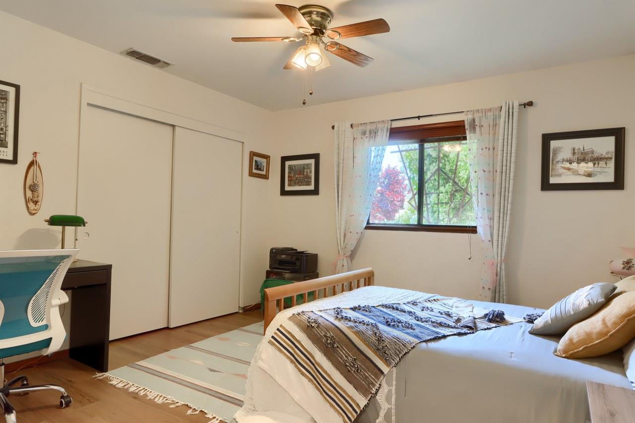 44800 Ahwahnee Acres Road Ahwahnee, CA 93601 - Photo 24 of 77 a bedroom with a bed and a window