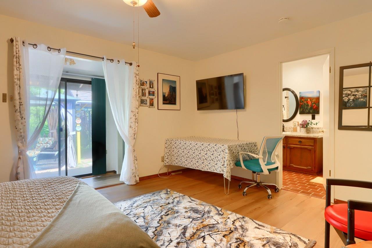 44800 Ahwahnee Acres Road Ahwahnee, CA 93601 - Photo 31 of 77 a bedroom with furniture and a rug