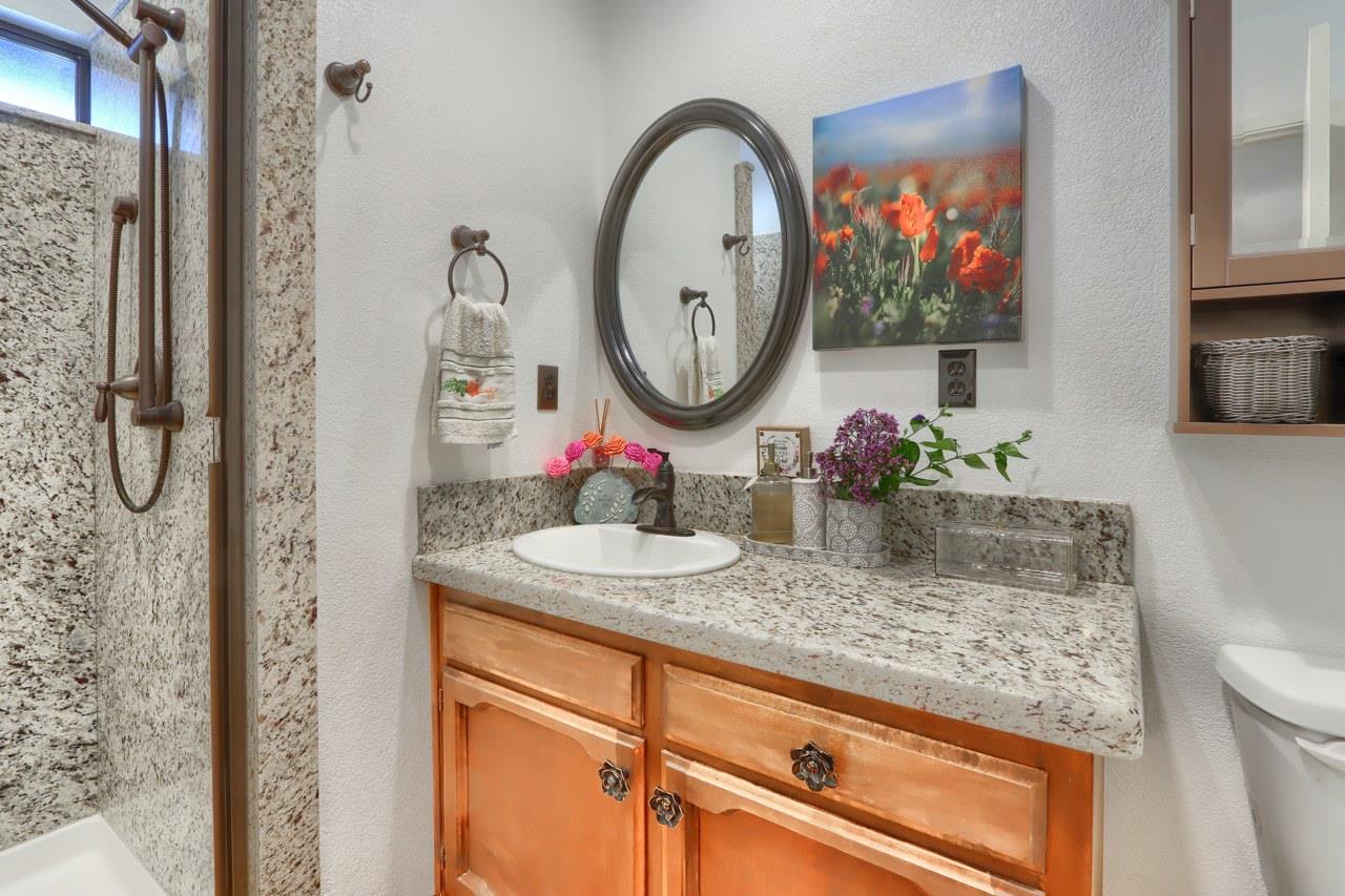 44800 Ahwahnee Acres Road Ahwahnee, CA 93601 - Photo 32 of 77 a bathroom with a sink and a mirror