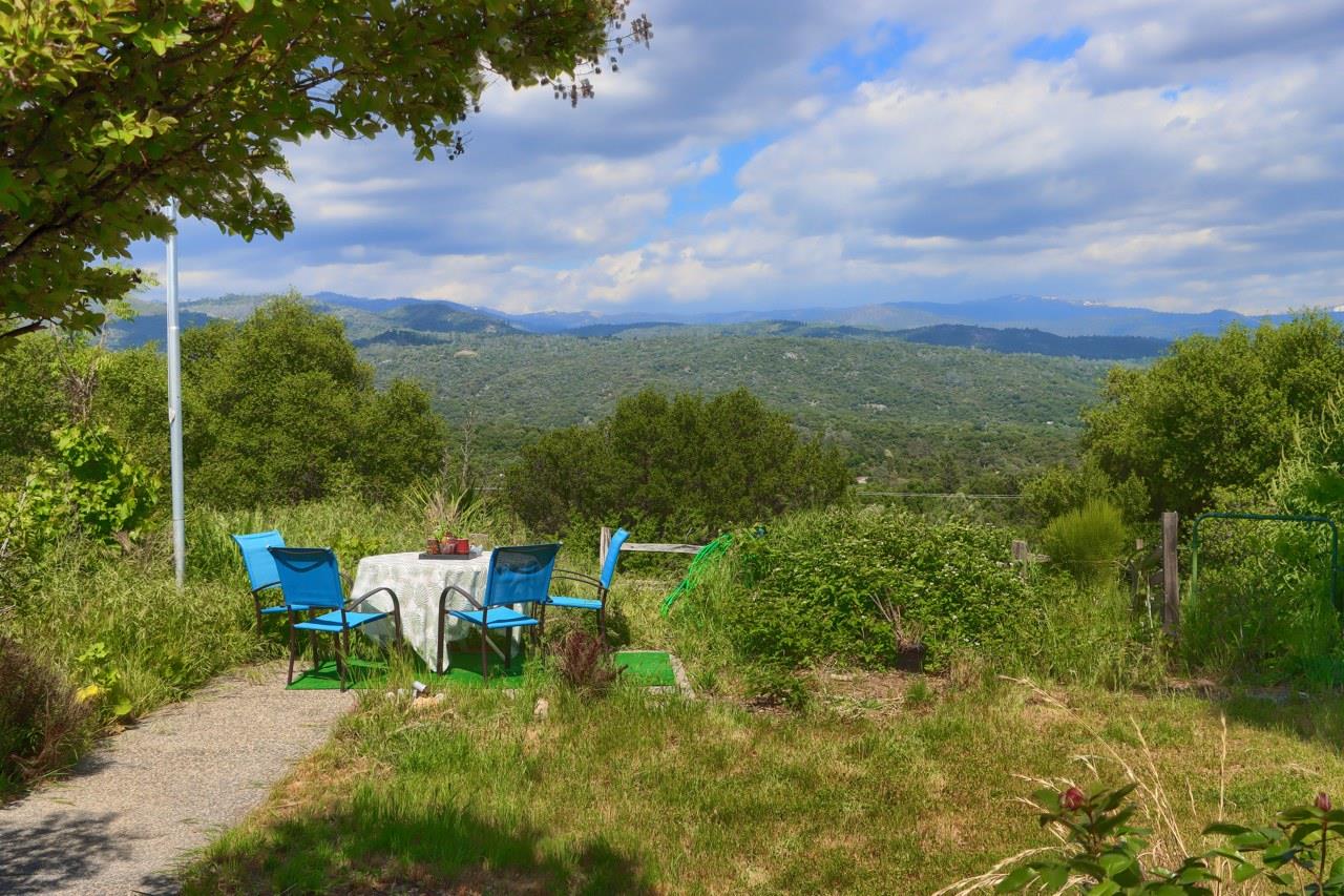 44800 Ahwahnee Acres Road Ahwahnee, CA 93601 - Photo 48 of 77 a view of a garden with lawn chairs