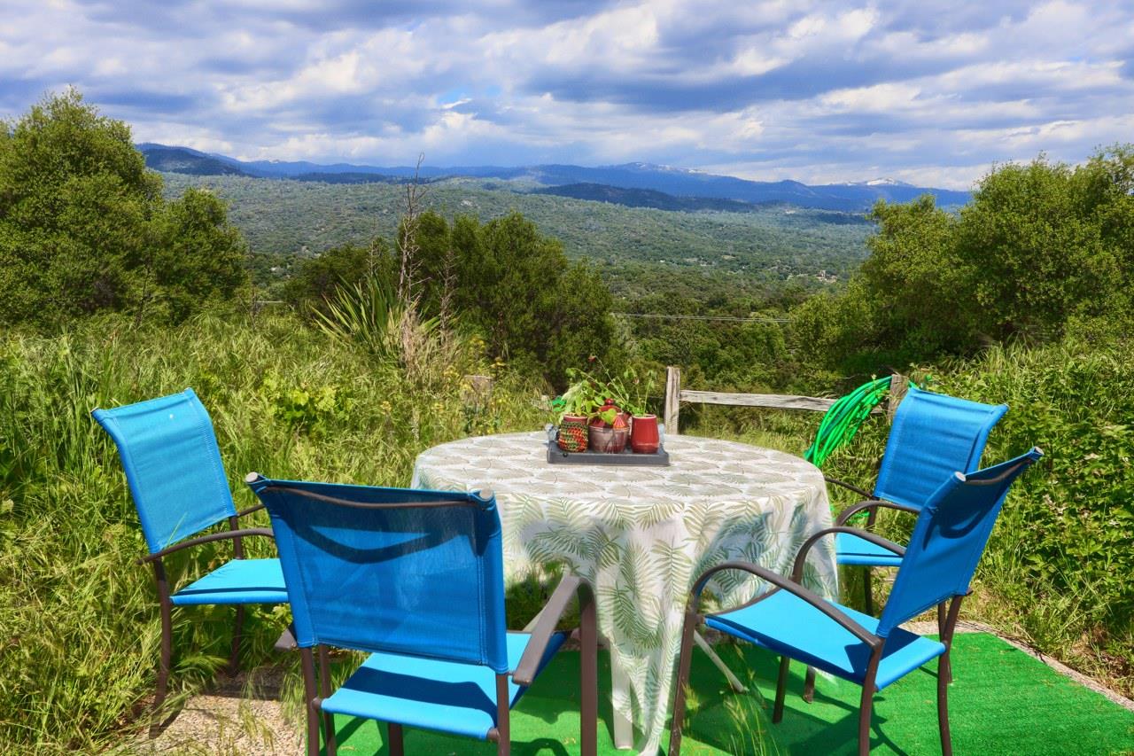 44800 Ahwahnee Acres Road Ahwahnee, CA 93601 - Photo 49 of 77 a view of a chairs and table in the patio
