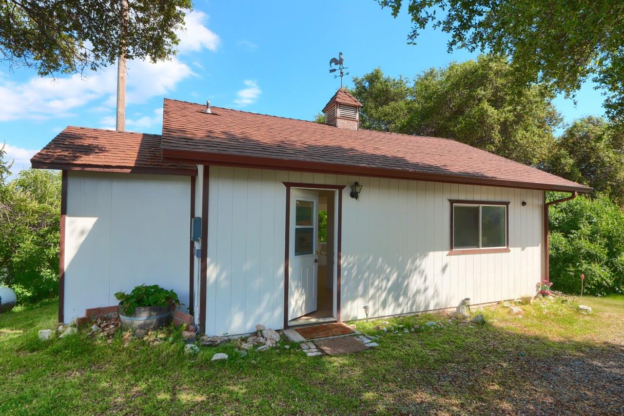 44800 Ahwahnee Acres Road Ahwahnee, CA 93601 - Photo 53 of 77 a backyard of a house with table and chairs