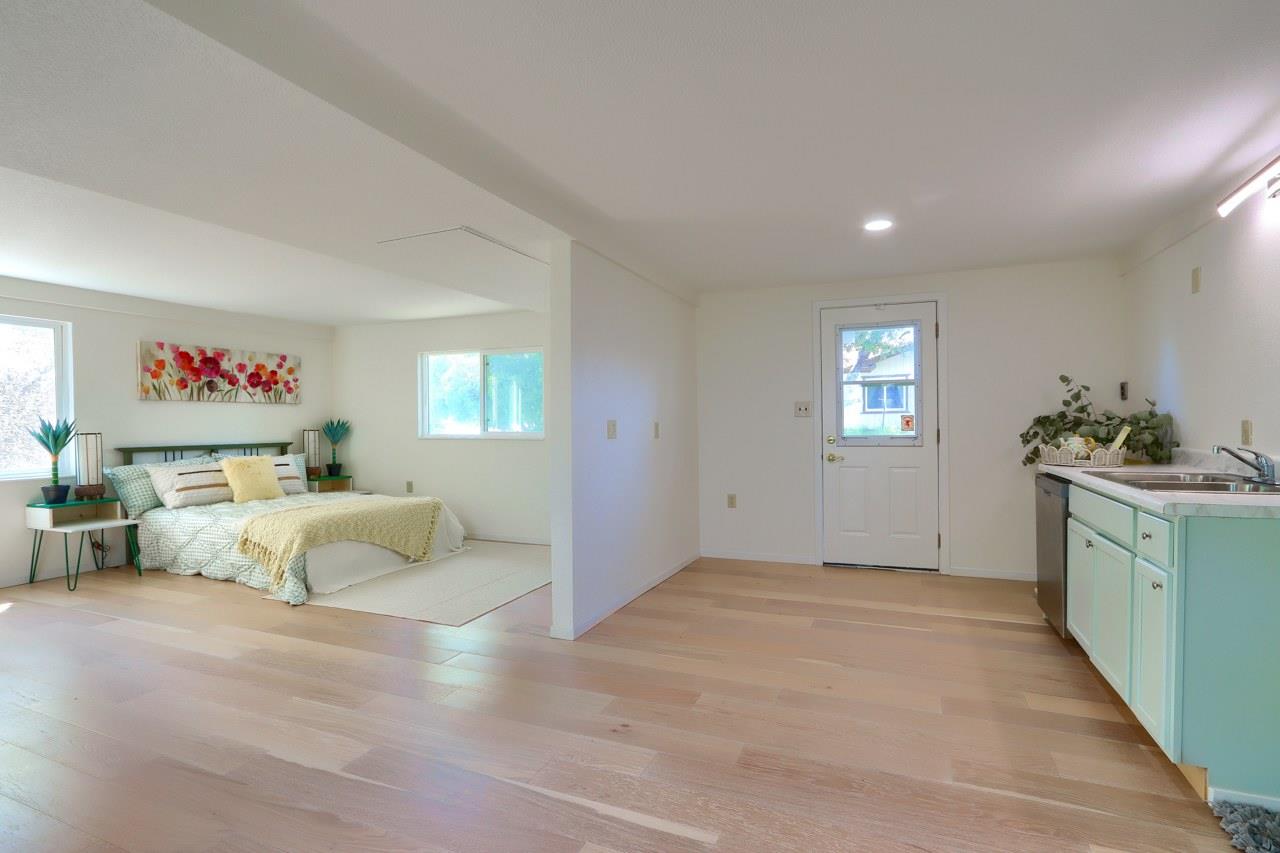 44800 Ahwahnee Acres Road Ahwahnee, CA 93601 - Photo 54 of 77 a spacious bedroom with a bed and a couch