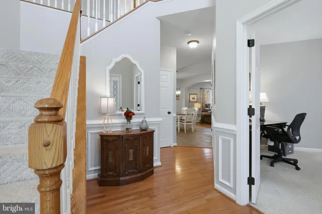 a view of living room with furniture and wooden floor