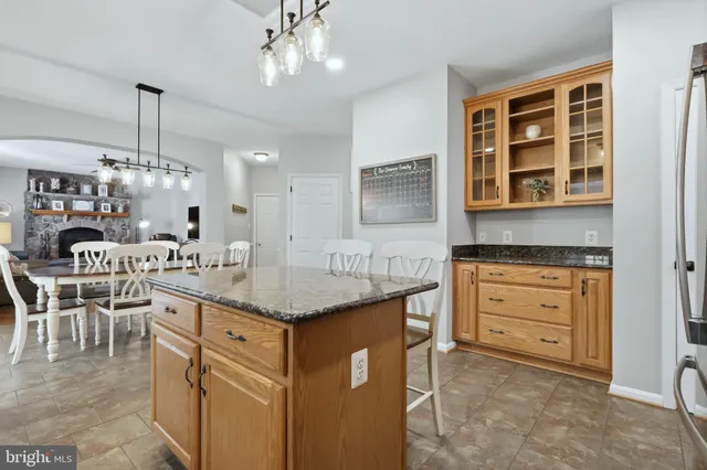 a view of front door with chair and cabinet