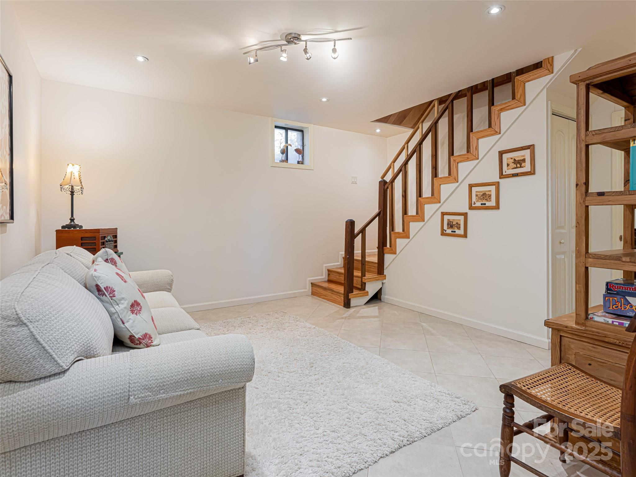 75 Deep Woods Road Mills River, NC 28759 - Photo 24 of 48 a living room with furniture and stairs