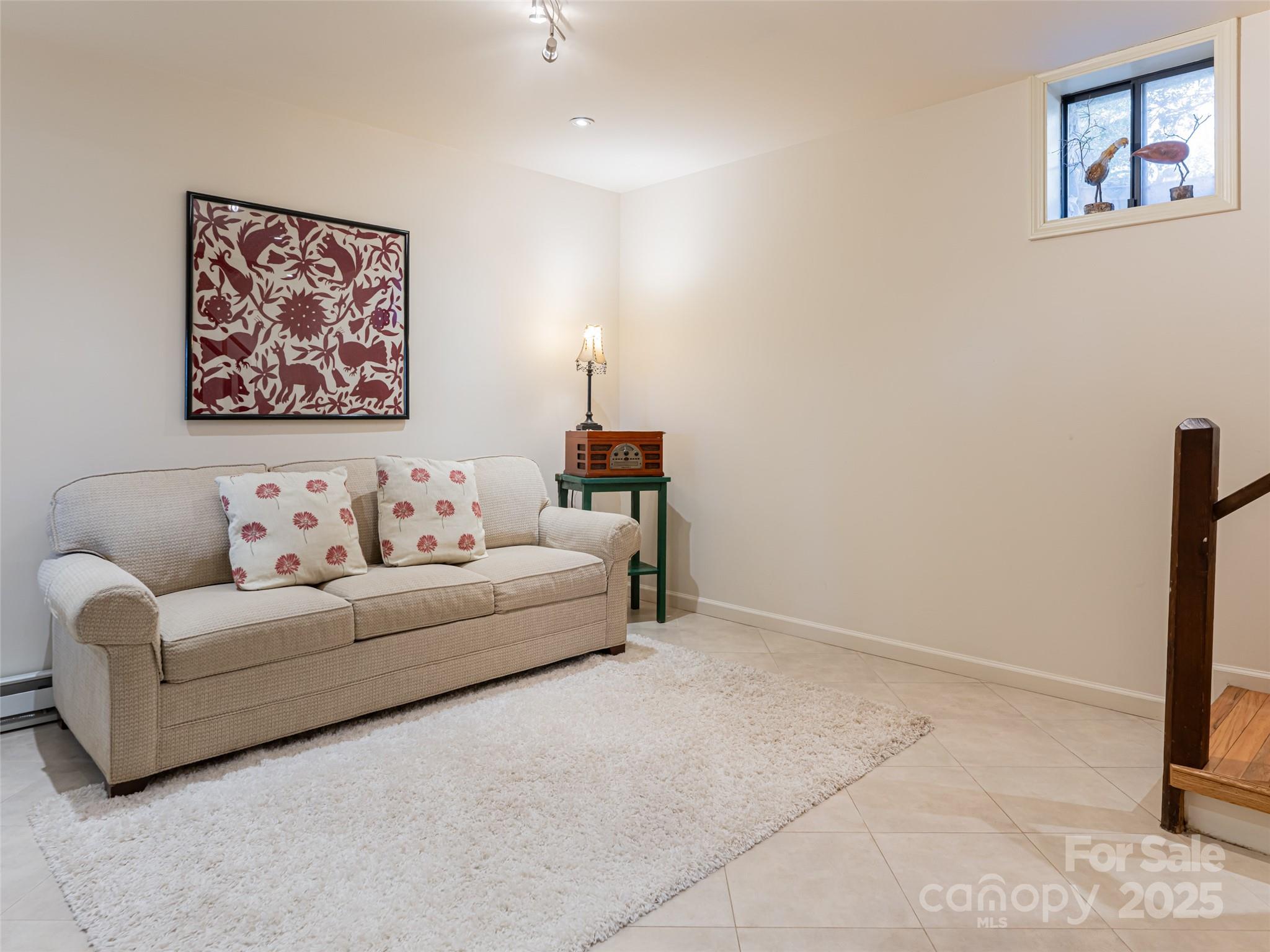 75 Deep Woods Road Mills River, NC 28759 - Photo 25 of 48 a living room with furniture and a painting on the wall