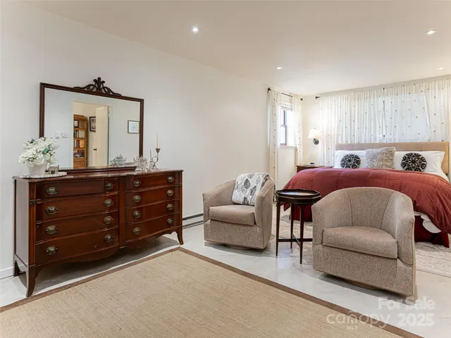 a bedroom with a bed and a couch