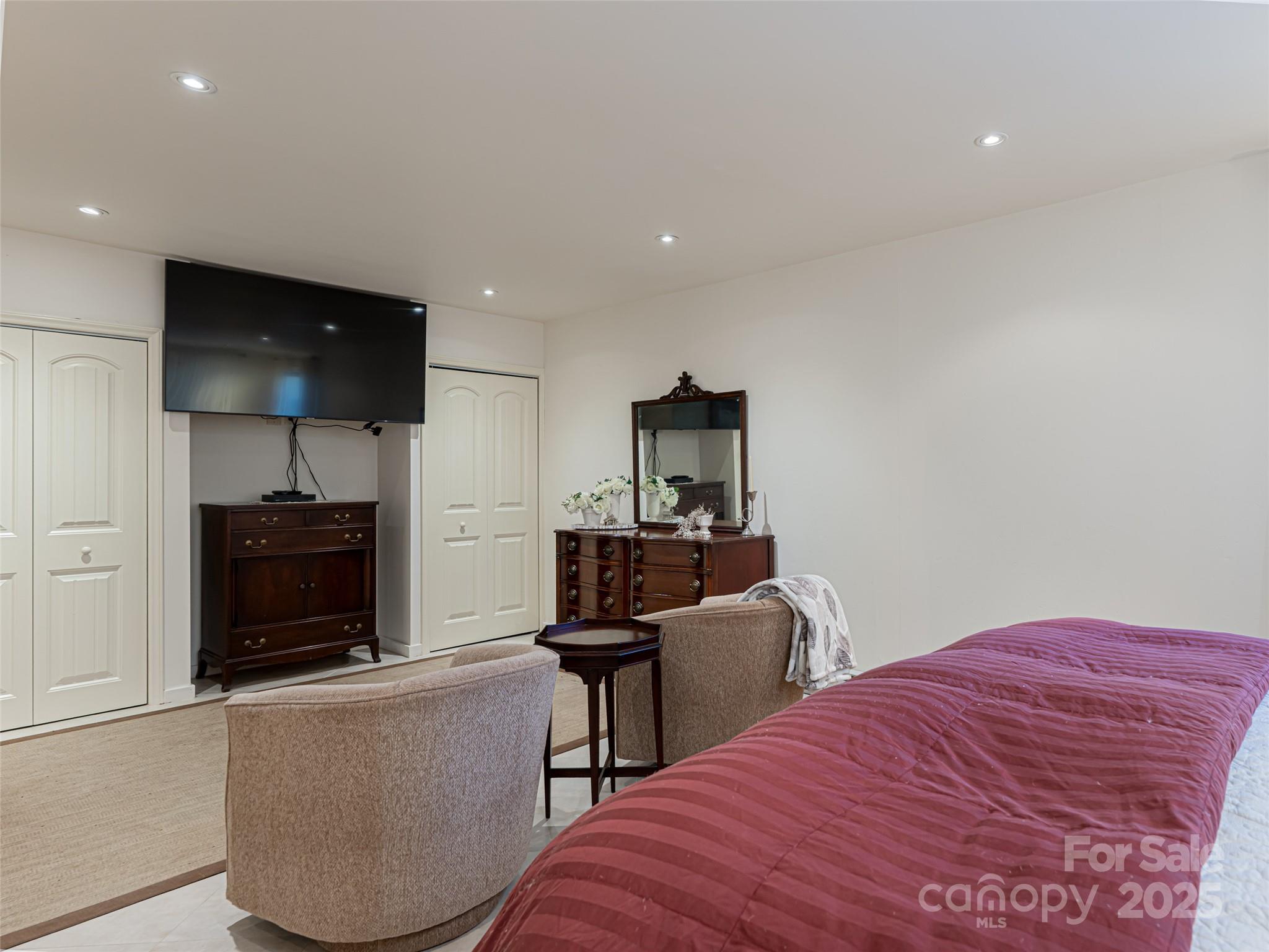 75 Deep Woods Road Mills River, NC 28759 - Photo 27 of 48 a bedroom with a bed and a flat screen tv