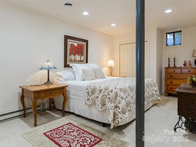 a bedroom with a bed and furniture