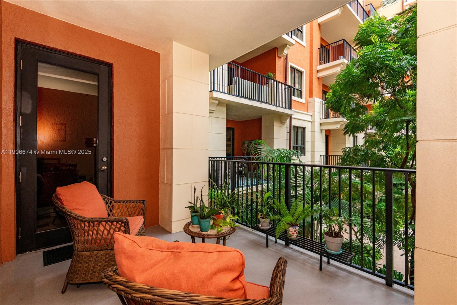 100 Andalusia Avenue, Unit 210 Coral Gables, FL 33134 - Photo 26 of 29 a balcony with table and chairs
