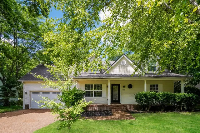 front view of a house with a garden