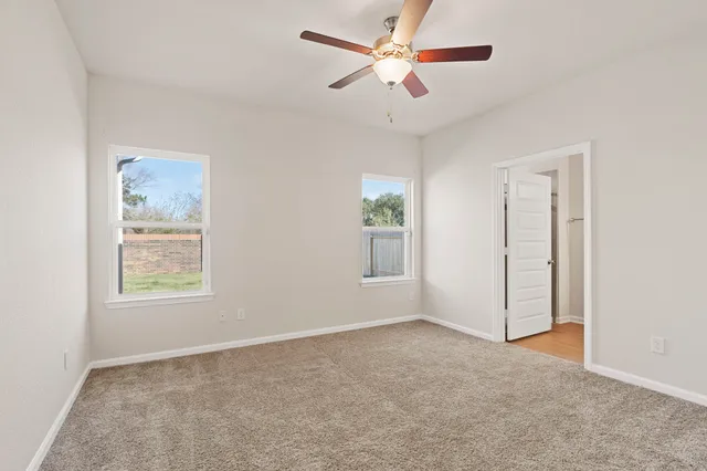 a view of an empty room with a window