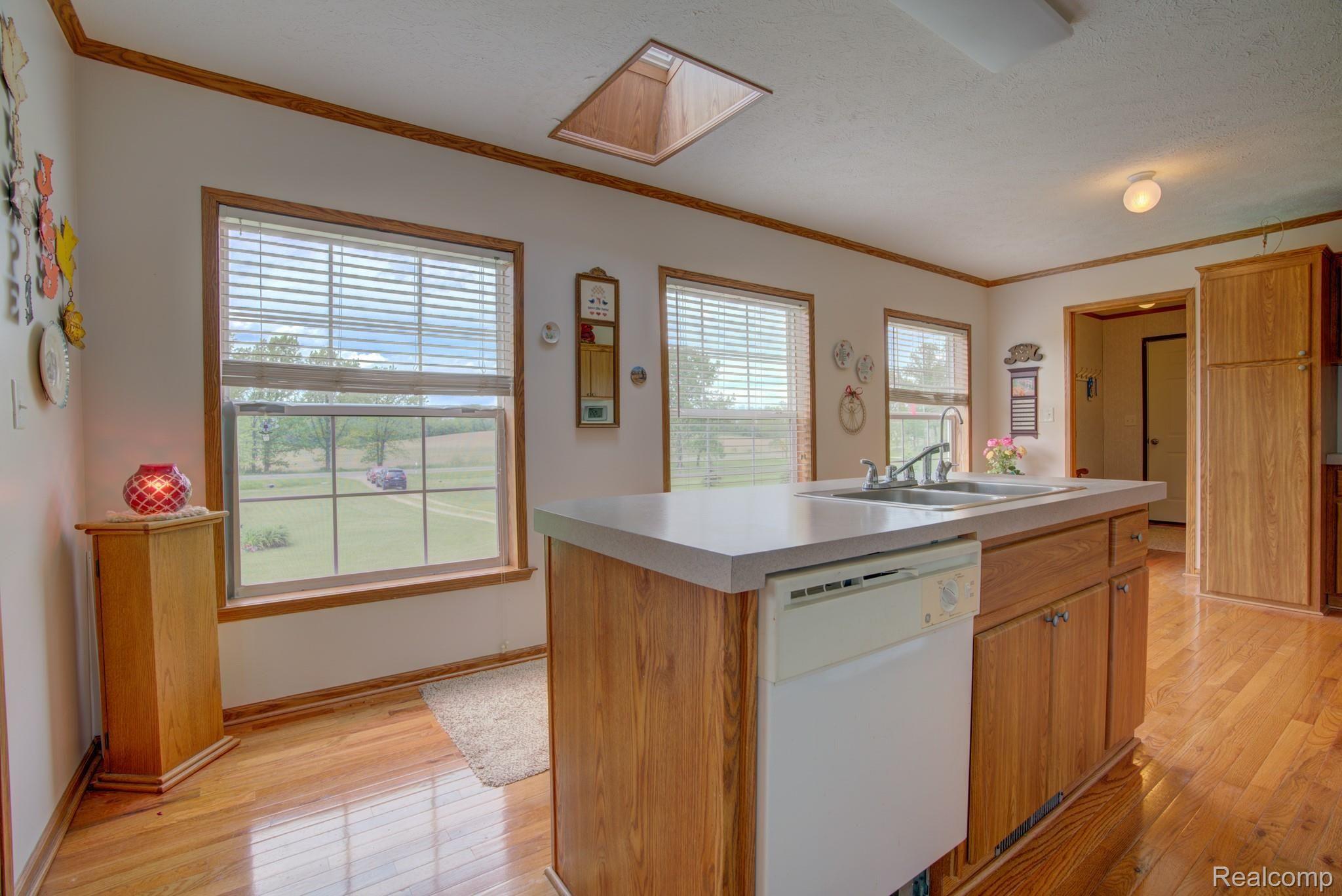 12145 South Bancroft Road Morrice, MI 48857 - Photo 12 of 41 SKYLIGHT FOR ADDTIONAL NATURAL LIGHTING