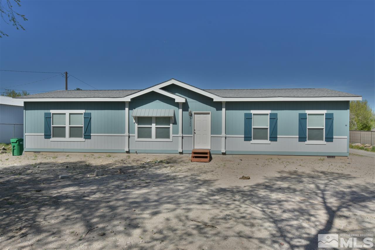 15355 Kivett Lane Reno, NV 89521 - Photo 3 of 15 a front view of a house with a garden