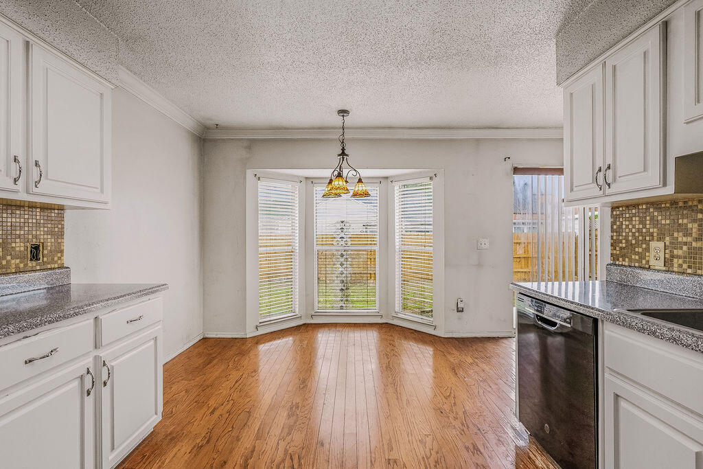 53 4th Street Shalimar, FL 32579 - Photo 15 of 47 a view of a kitchen with wooden floor and electronic appliances