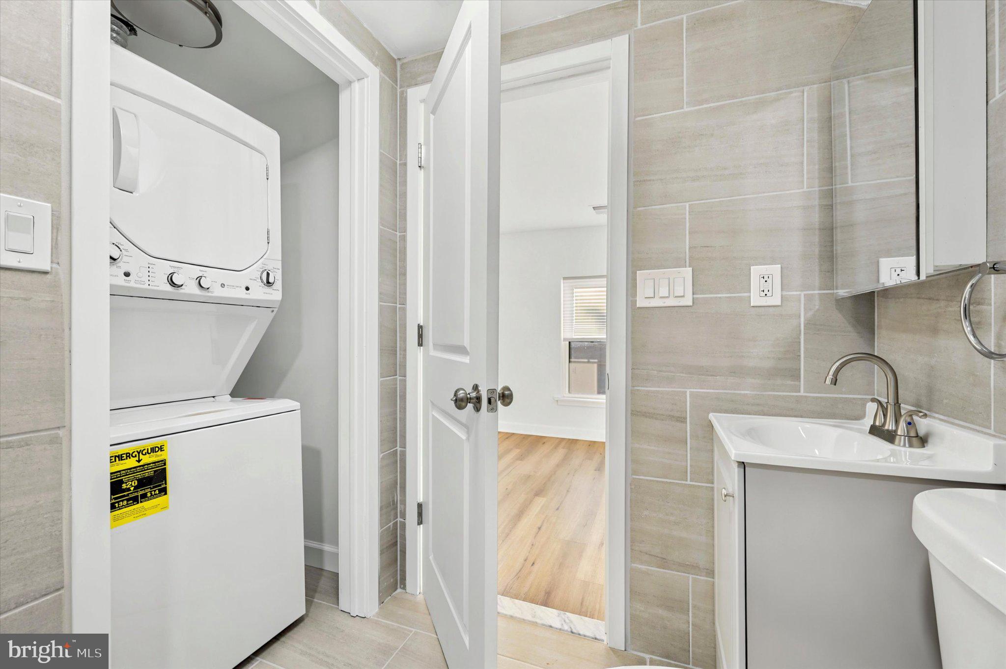 514 Ryers Avenue, Unit B Cheltenham, PA 19012 - Photo 17 of 21 Modern laundry nook in sleek design.
