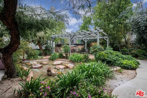 a view of a garden with a fountain