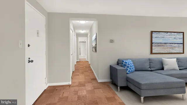 a living room with furniture and a rug