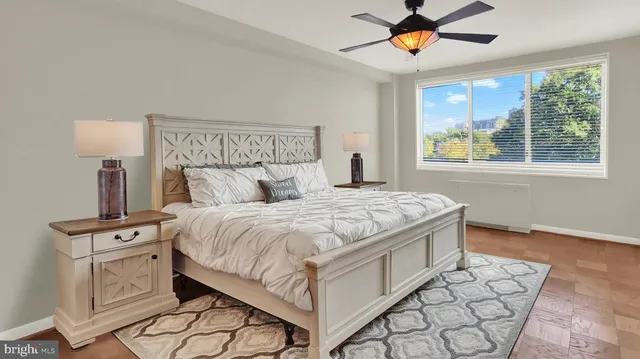 a bedroom with a bed and window