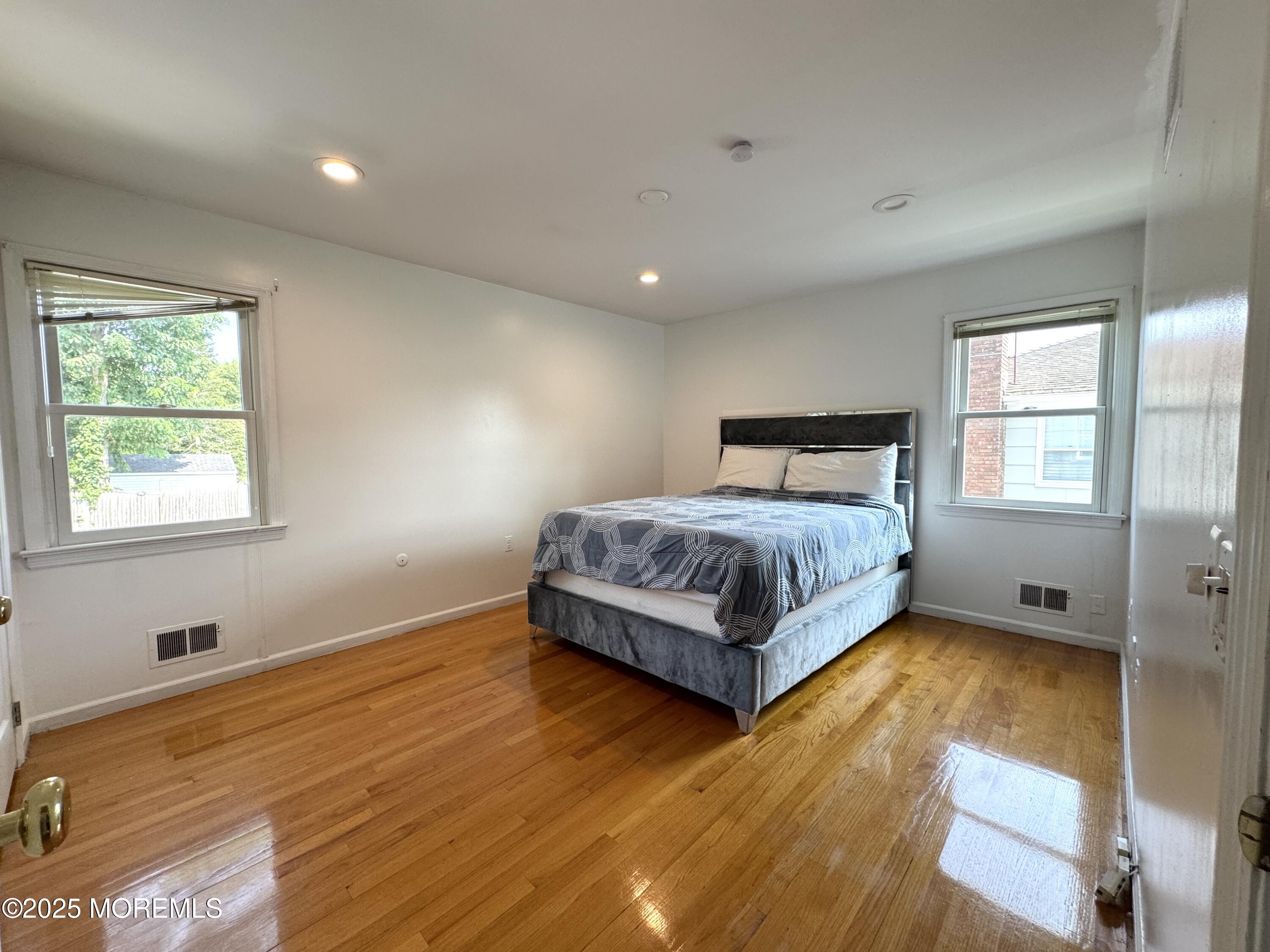 28 Ridge Road West Long Branch, NJ 07764 - Photo 5 of 8 a bedroom with a bed and window