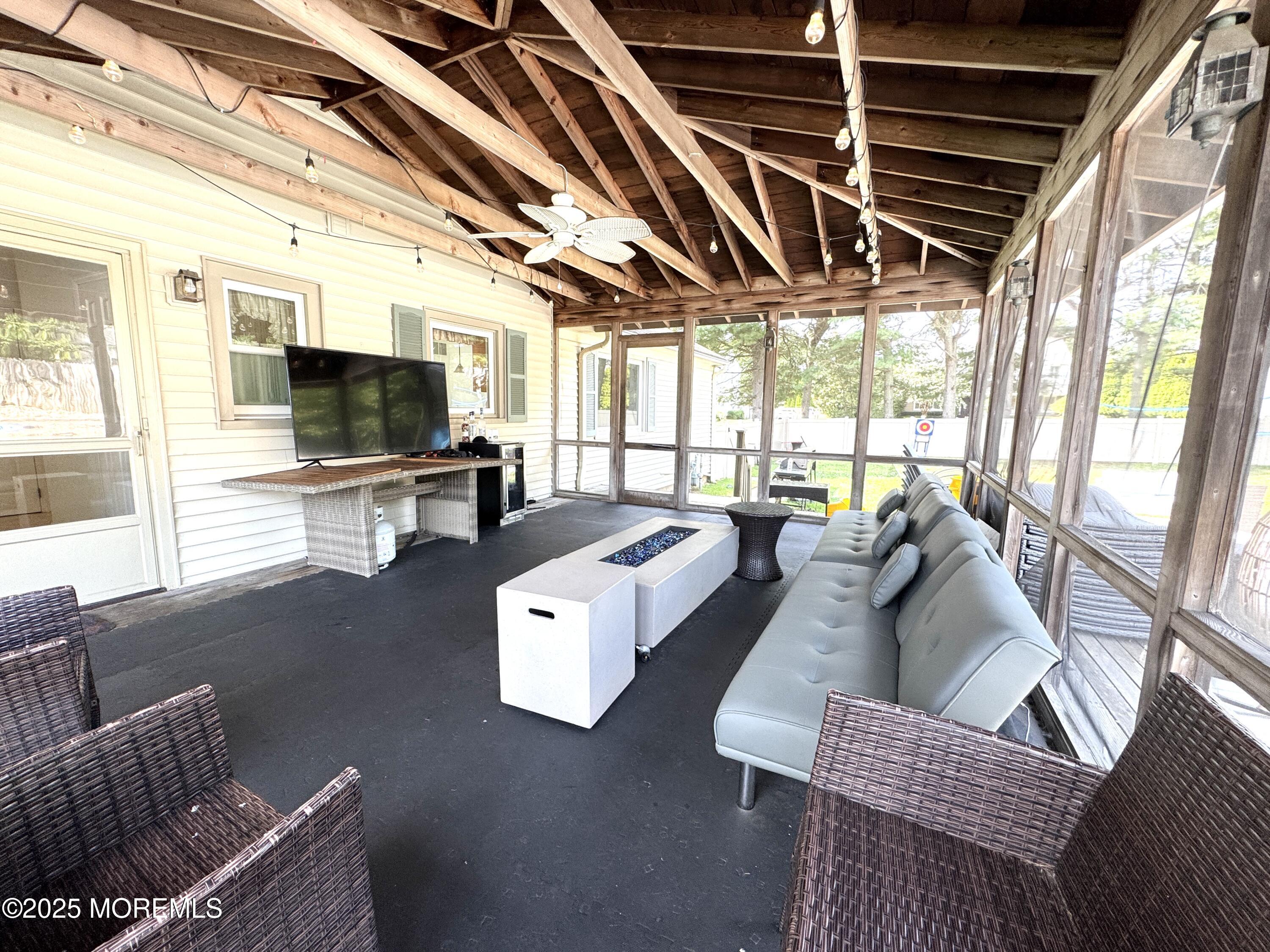 28 Ridge Road West Long Branch, NJ 07764 - Photo 8 of 8 a living room with furniture and a flat screen tv