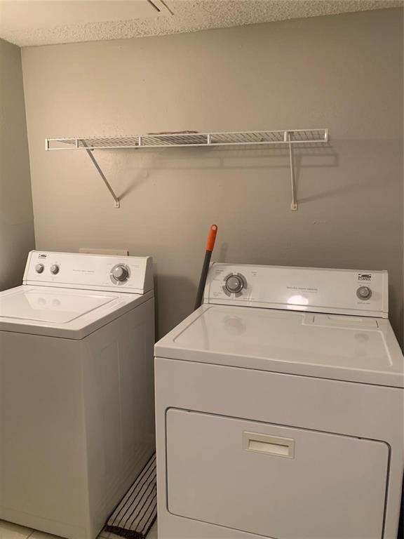 5300 Keller Springs Road, Unit 2020 Dallas, TX 75248 - Photo 12 of 15 a utility room with dryer and washer