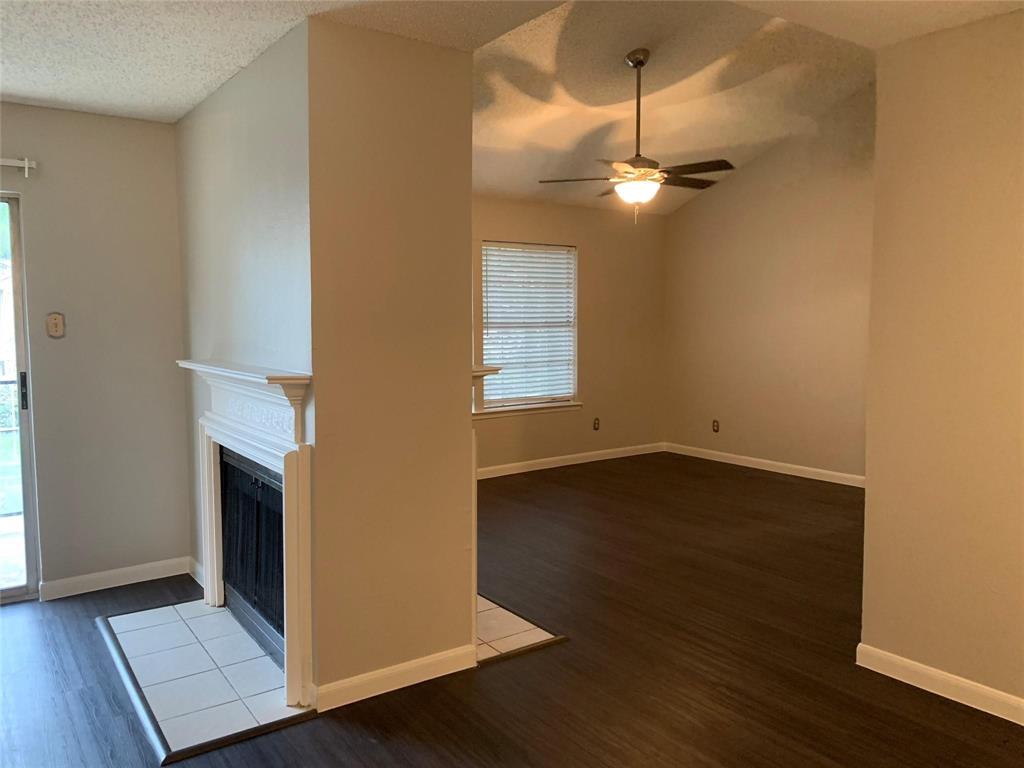 5300 Keller Springs Road, Unit 2020 Dallas, TX 75248 - Photo 2 of 15 a view of empty room with wooden floor and fan
