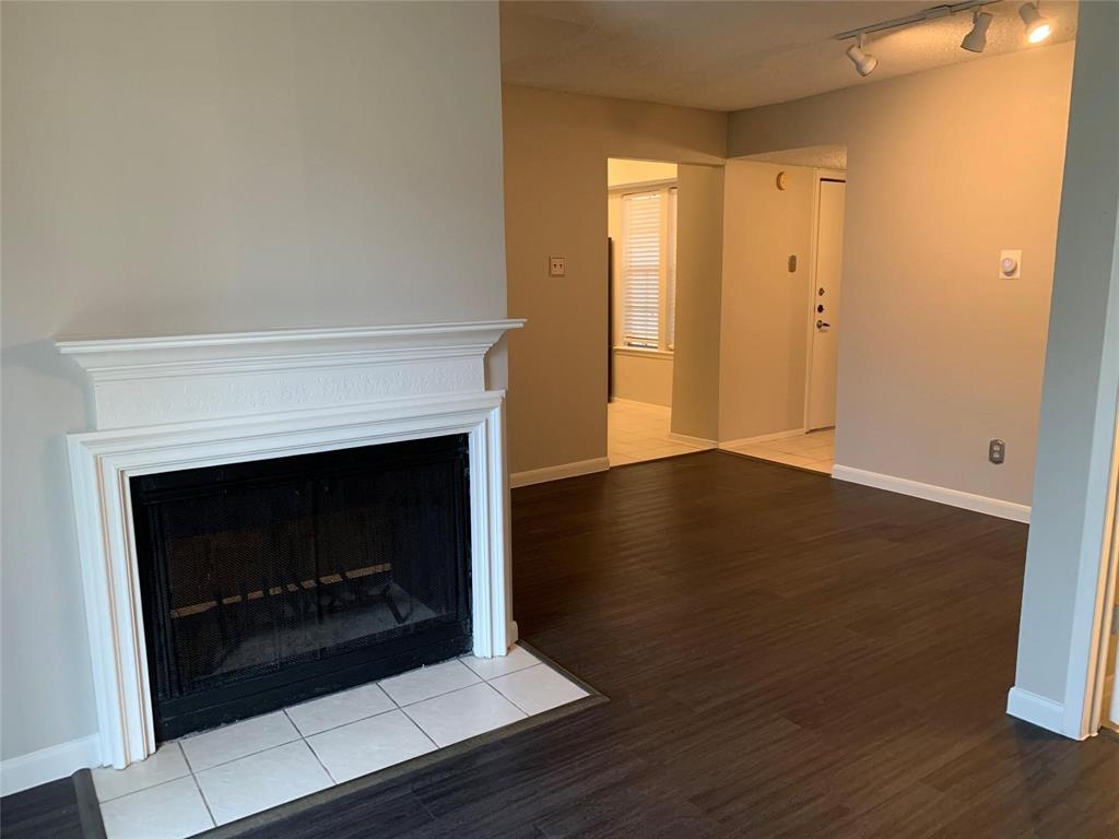 5300 Keller Springs Road, Unit 2020 Dallas, TX 75248 - Photo 4 of 15 a living room with a fireplace
