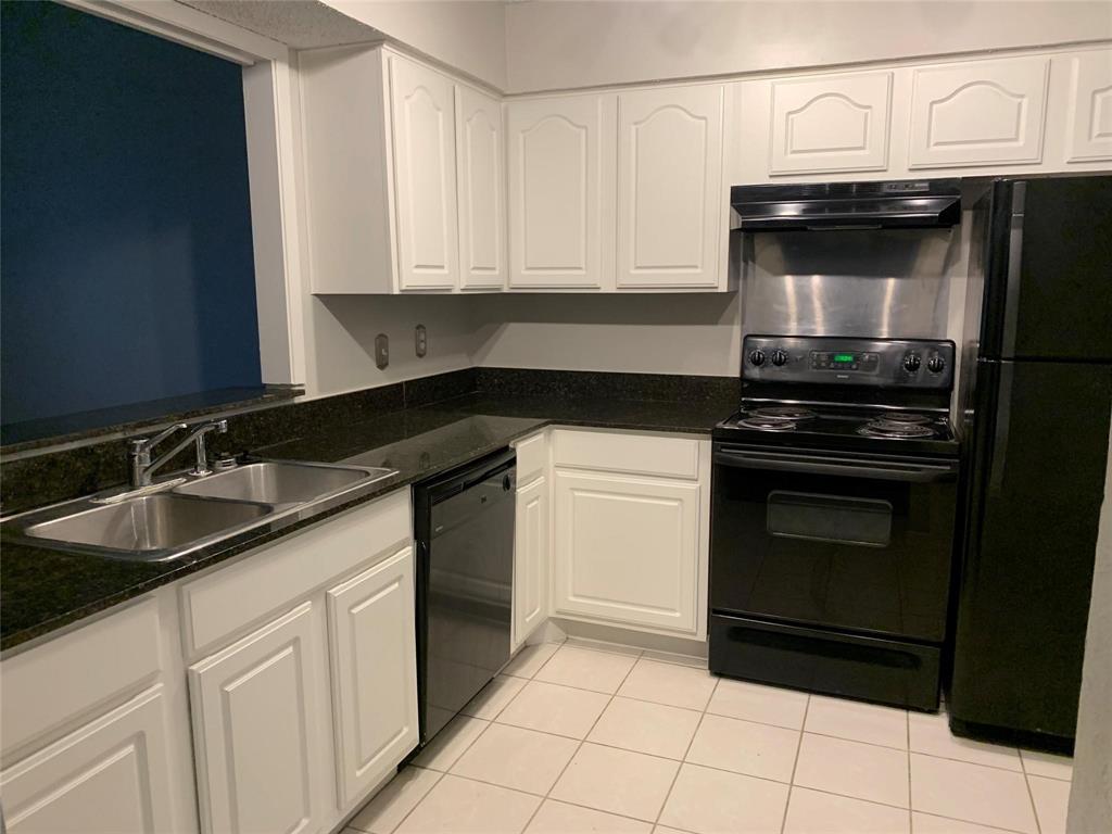 5300 Keller Springs Road, Unit 2020 Dallas, TX 75248 - Photo 5 of 15 a kitchen with granite countertop a stove sink and cabinets