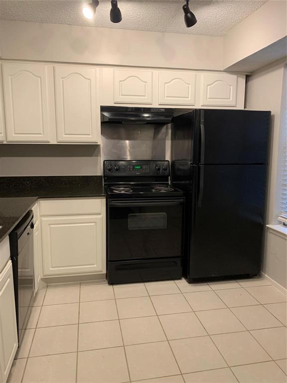 5300 Keller Springs Road, Unit 2020 Dallas, TX 75248 - Photo 6 of 15 a kitchen with stainless steel appliances granite countertop a stove and a refrigerator
