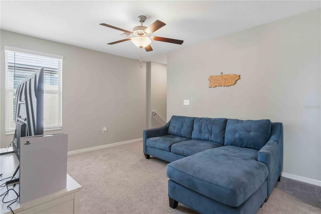 9440 Lemon Drop Loop Sun City Center, FL 33573 - Photo 25 of 55 a living room with furniture and a couch