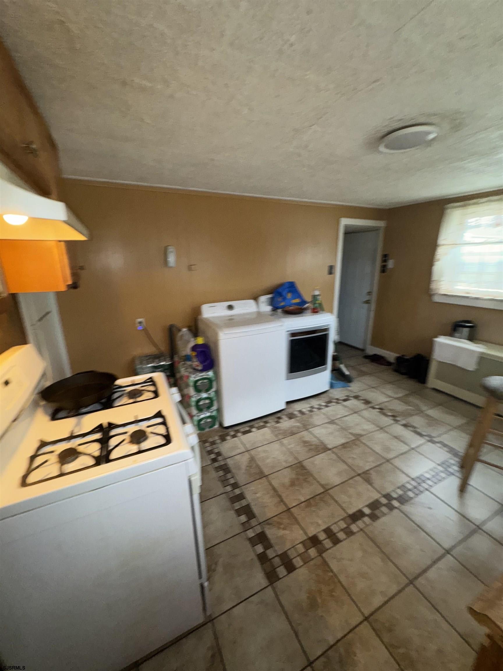 285 Spruce Street Bridgeton, NJ 08302 - Photo 3 of 11 a room with storage and utility