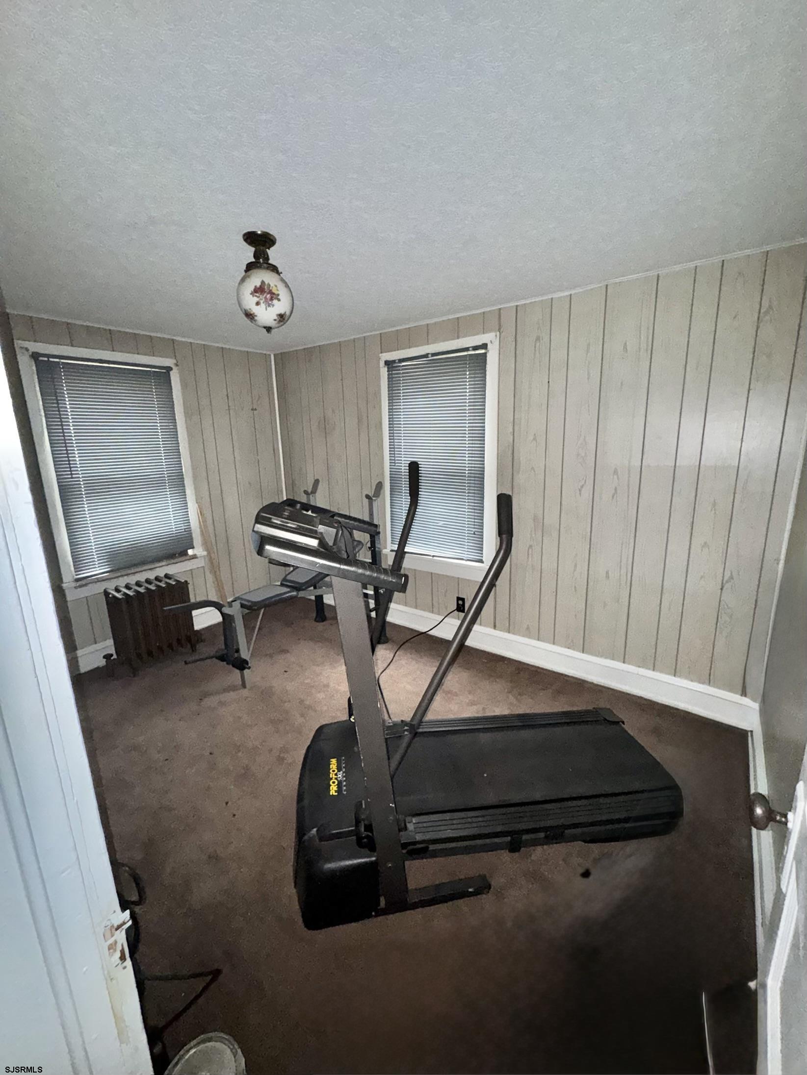 285 Spruce Street Bridgeton, NJ 08302 - Photo 7 of 11 a room with gym equipment