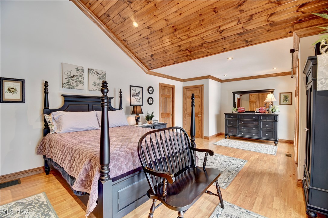 85553 Beagle Clb Road Scio, OH 43988 - Photo 23 of 50 Primary Bedroom with wooden ceiling, visible vents, baseboards, light wood-type flooring, and crown molding