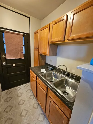 a kitchen with a stove and a sink