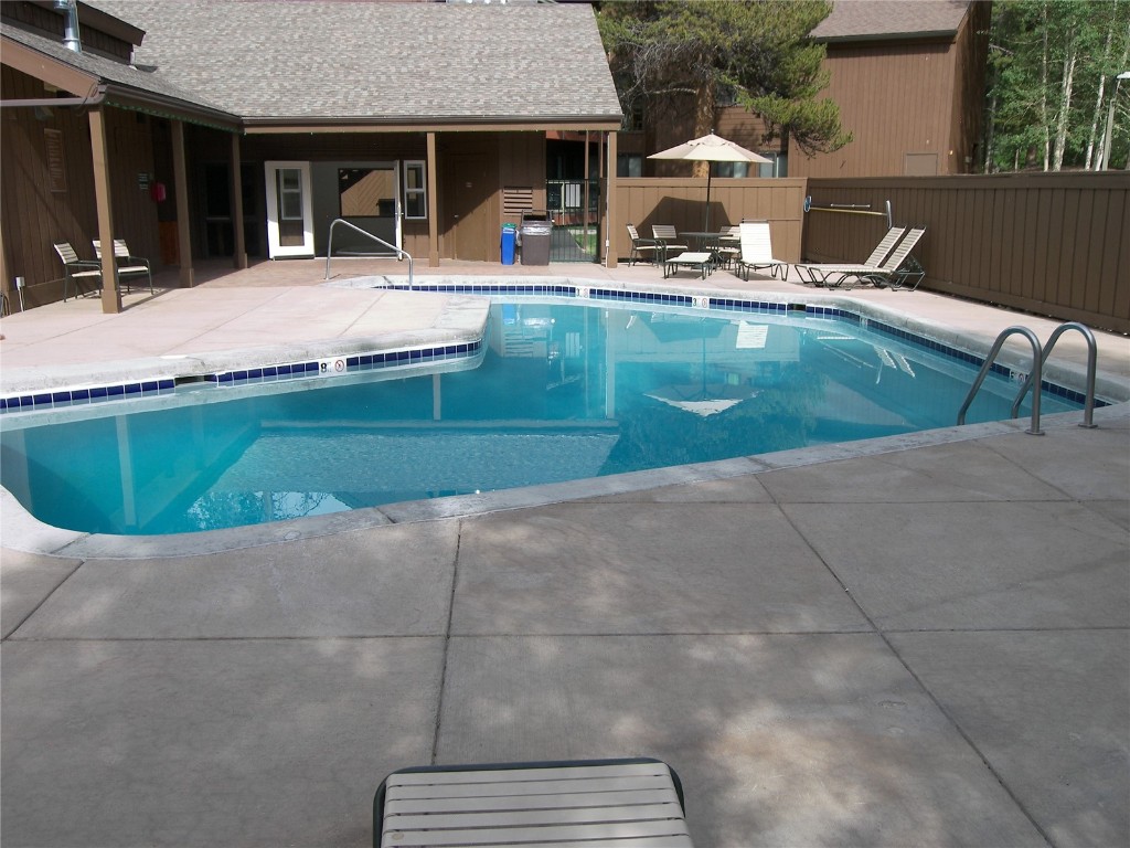 373 Wild Irishman Road, Unit 1071 Keystone, CO 80435 - Photo 14 of 22 Community pool with a patio area