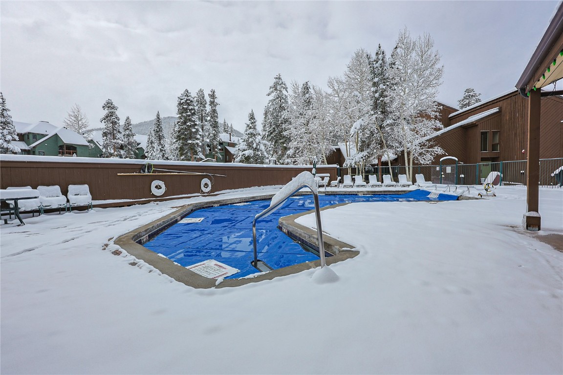373 Wild Irishman Road, Unit 1071 Keystone, CO 80435 - Photo 15 of 22 Snow covered pool with a community pool, a patio area, and a mountain view
