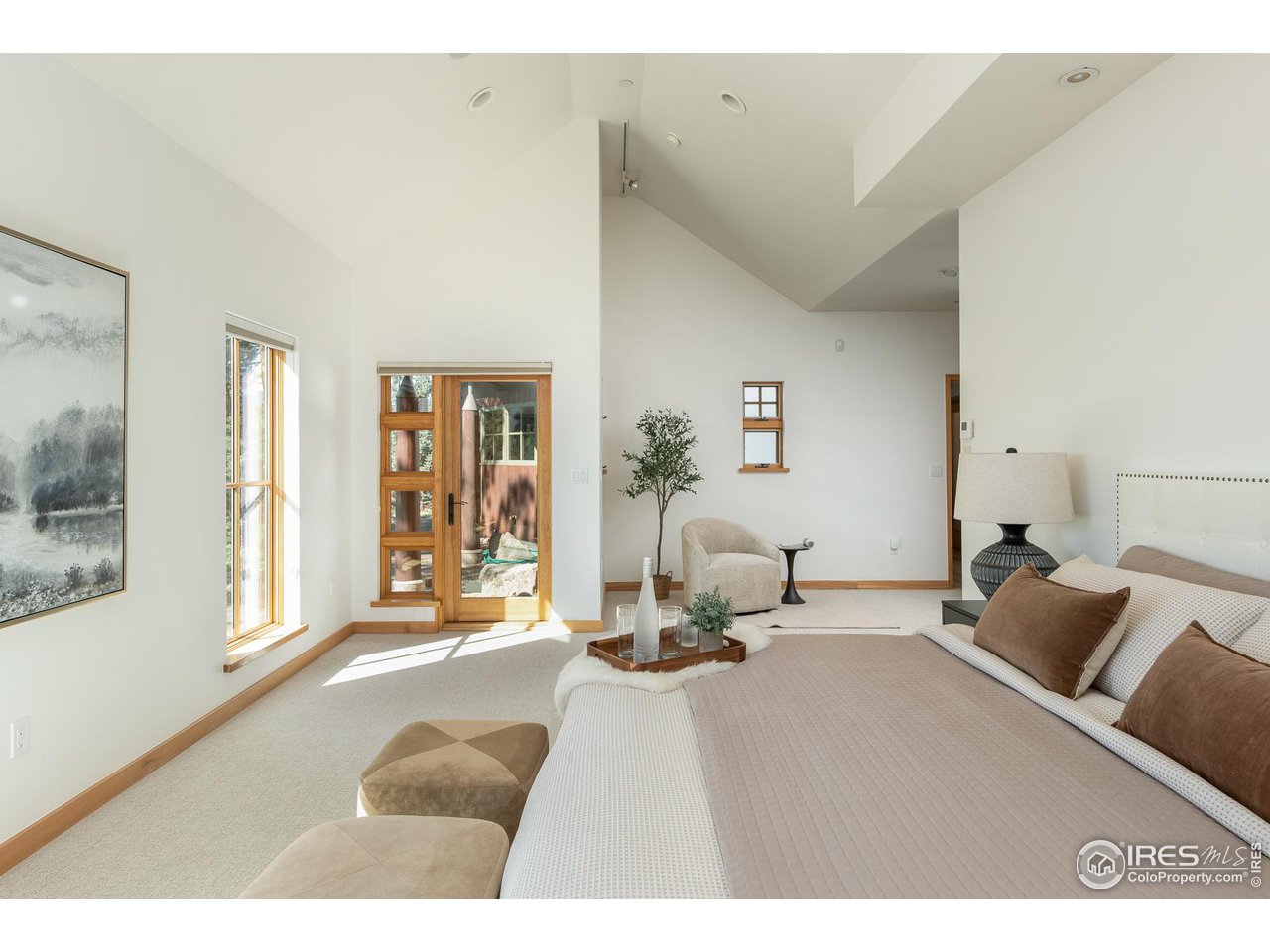 2358 Sunshine Canyon Drive Boulder, CO 80302 - Photo 11 of 36 a bedroom with furniture and a large window