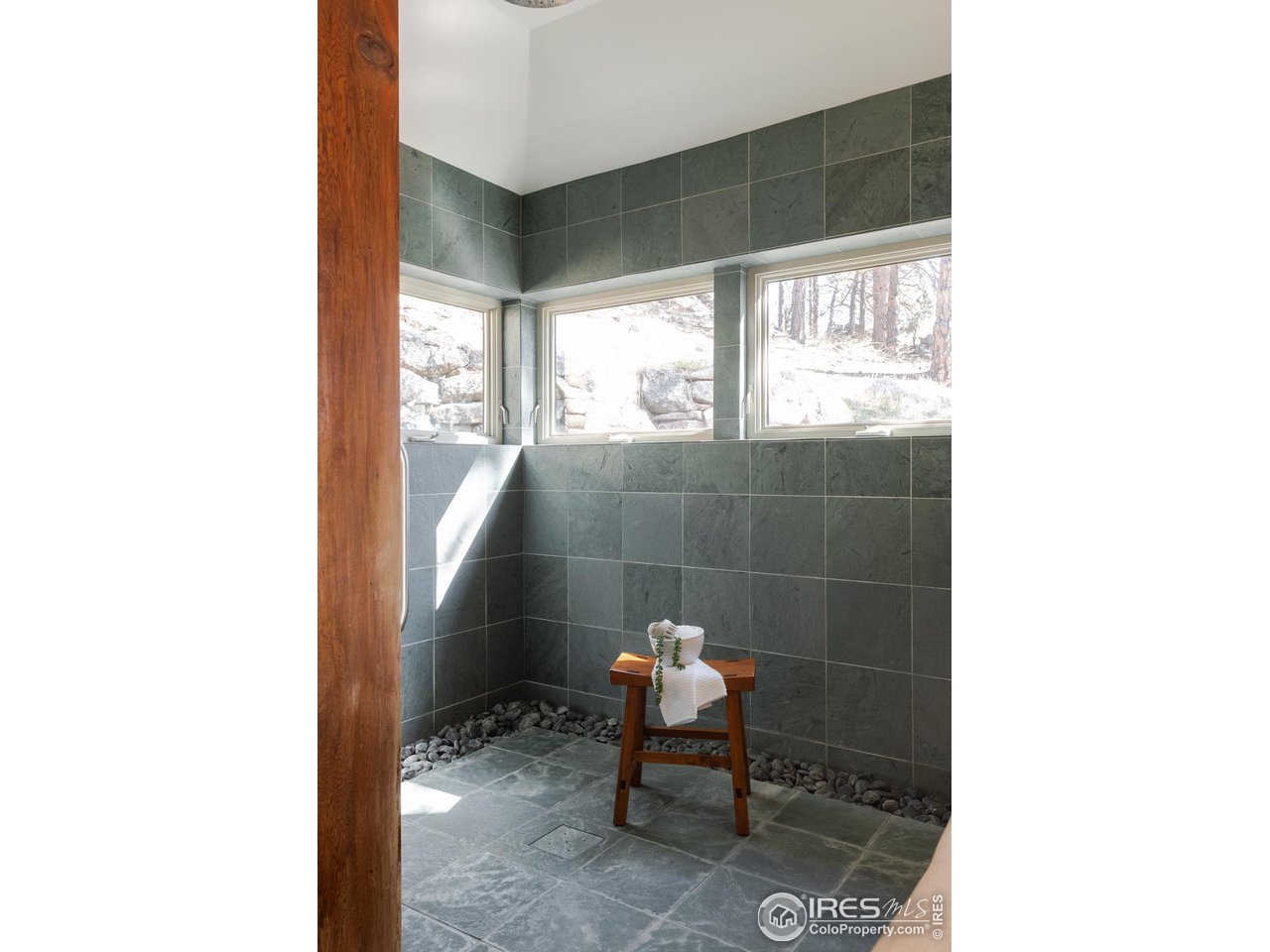 2358 Sunshine Canyon Drive Boulder, CO 80302 - Photo 13 of 36 a bathroom with a sink and a window
