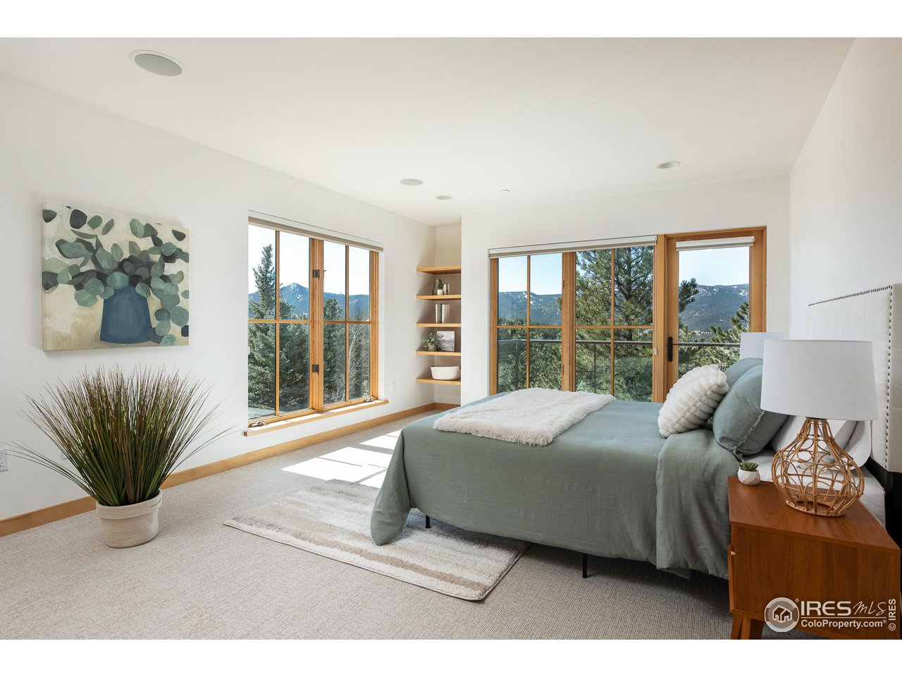 2358 Sunshine Canyon Drive Boulder, CO 80302 - Photo 23 of 36 a bedroom with a bed and a large window